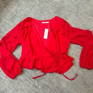 Francesca’s Miami Red wrap blouse, size medium. Never worn